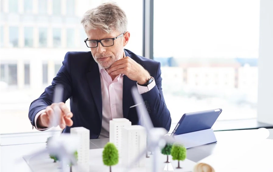 A man focusing on real estate investment structures