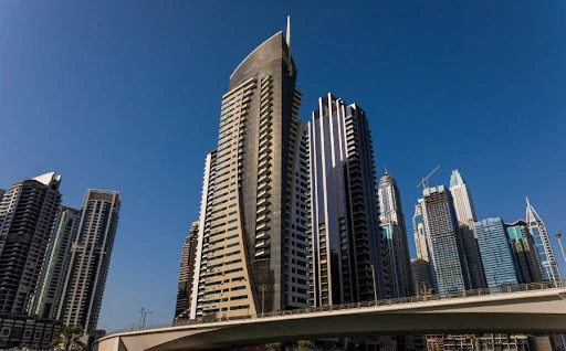 Modern skyscrapers and high-rise buildings in Dubai Marina skyline with clear blue sky