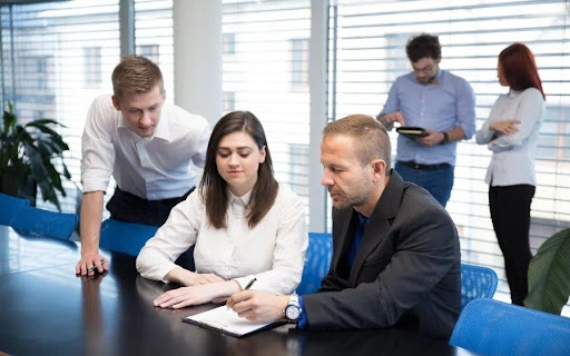 Consultants reviewing financial reports and data