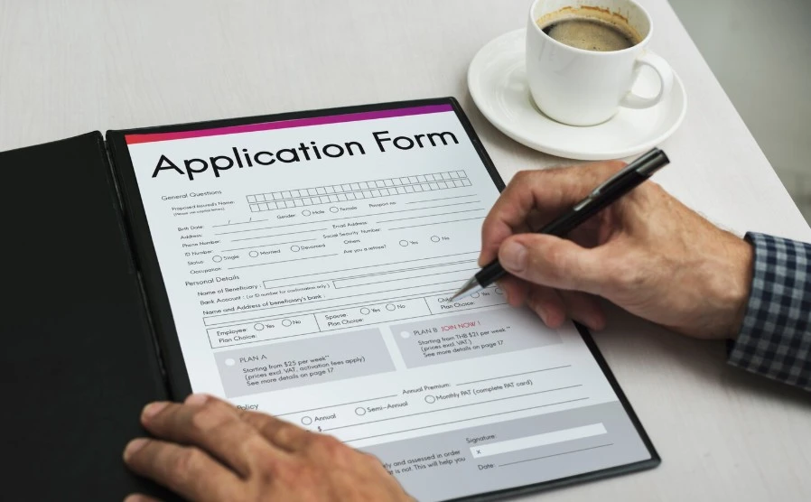 A person filling out fill out a business application form