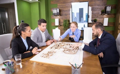 a group of professionals having a discussion on a business setup process