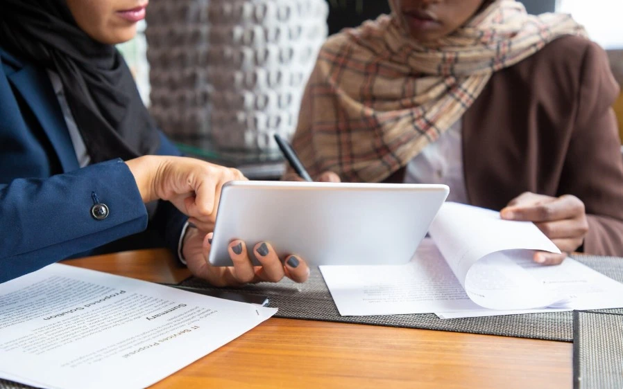 a professional woman handing over TRC to the client