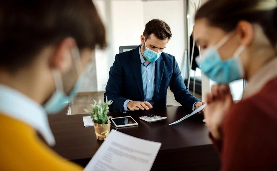 Insurance agent having a meeting with clients in the office