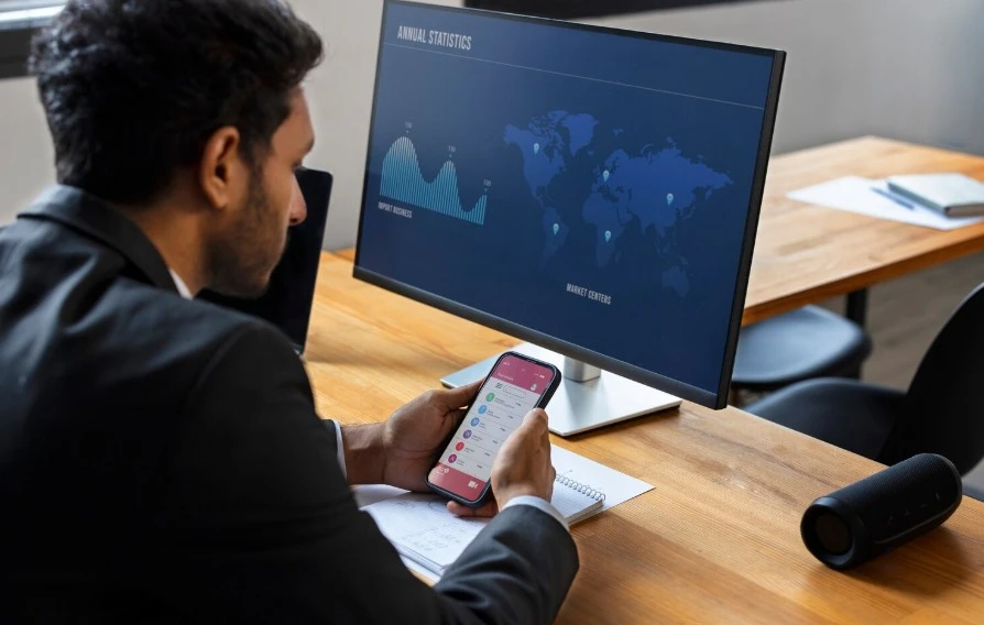 Business person looking at finance graphs