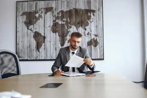 Man reading the UAE free zone corporate tax